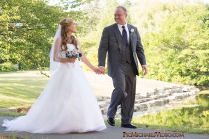 A Fall Wedding Couple Take A Casual Stroll Outdoors